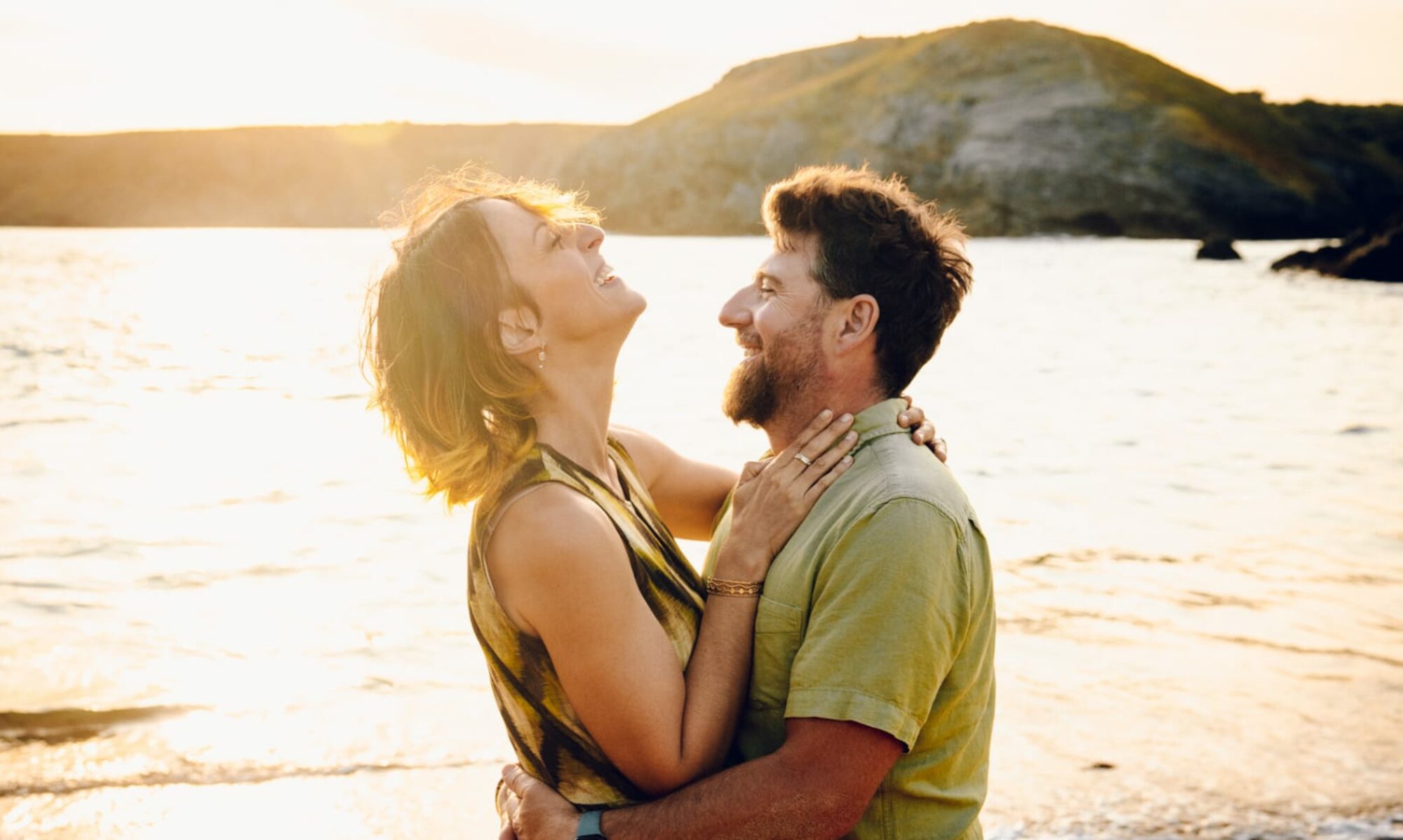 Beth left and David right on a sunny beach